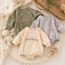 Personalized baby romper snap closure and soft cuff details