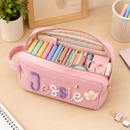 Kids stationery pouch with raised yarn lettering close up