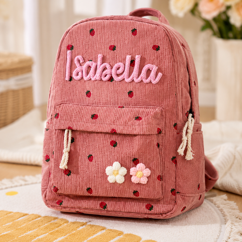 Personalized pink corduroy kids backpack with custom name detail