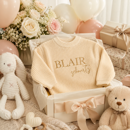 Baby knit sweater with embroidered name detail close up