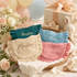 Muslin baby bib with personalized name detail close up