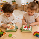 Two toddlers playing with custom name felt busy books for preschool learning