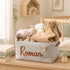 Personalized gray corduroy nursery storage basket with custom name baby clothes and plush toys