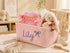 Personalized pink corduroy nursery storage basket with custom name baby clothes and plush toys